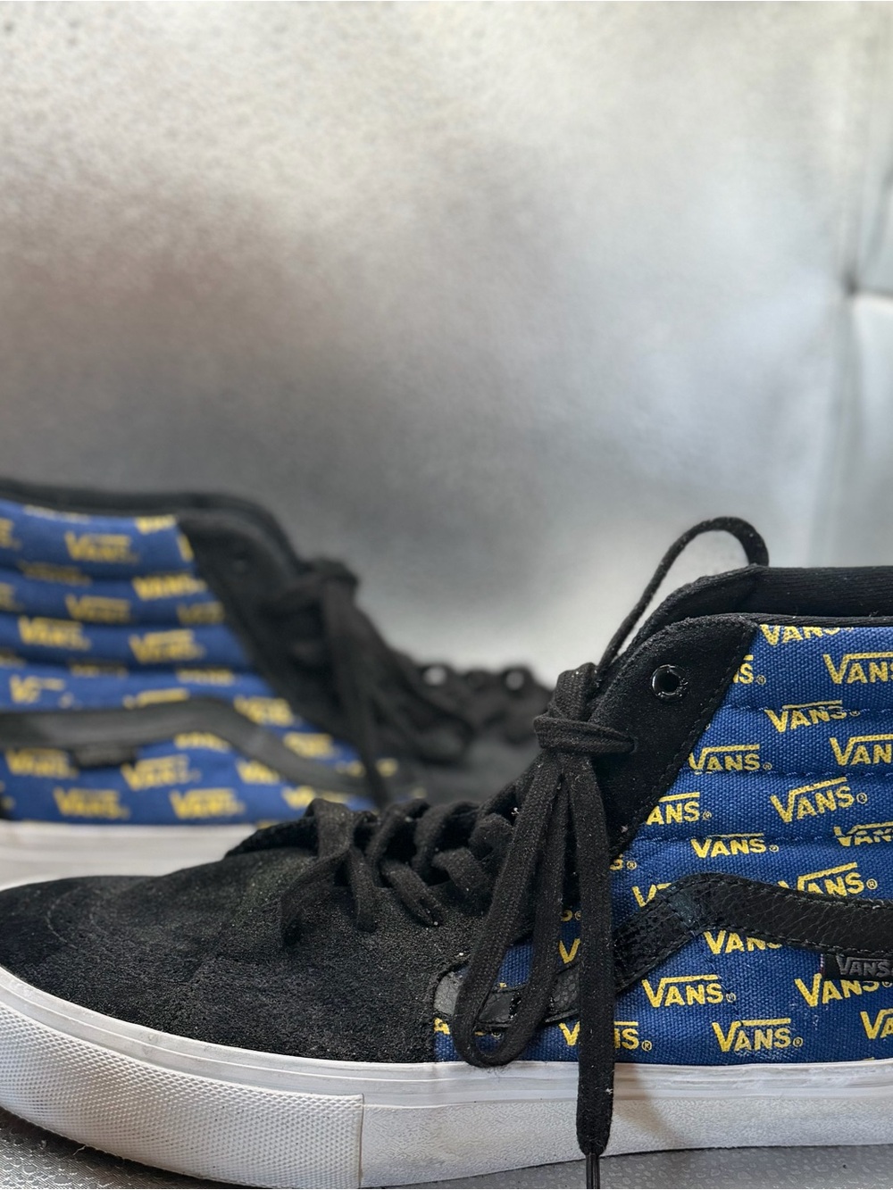 Vans Black and Blue High-Top Athletic Shoes with Yellow Logo Print